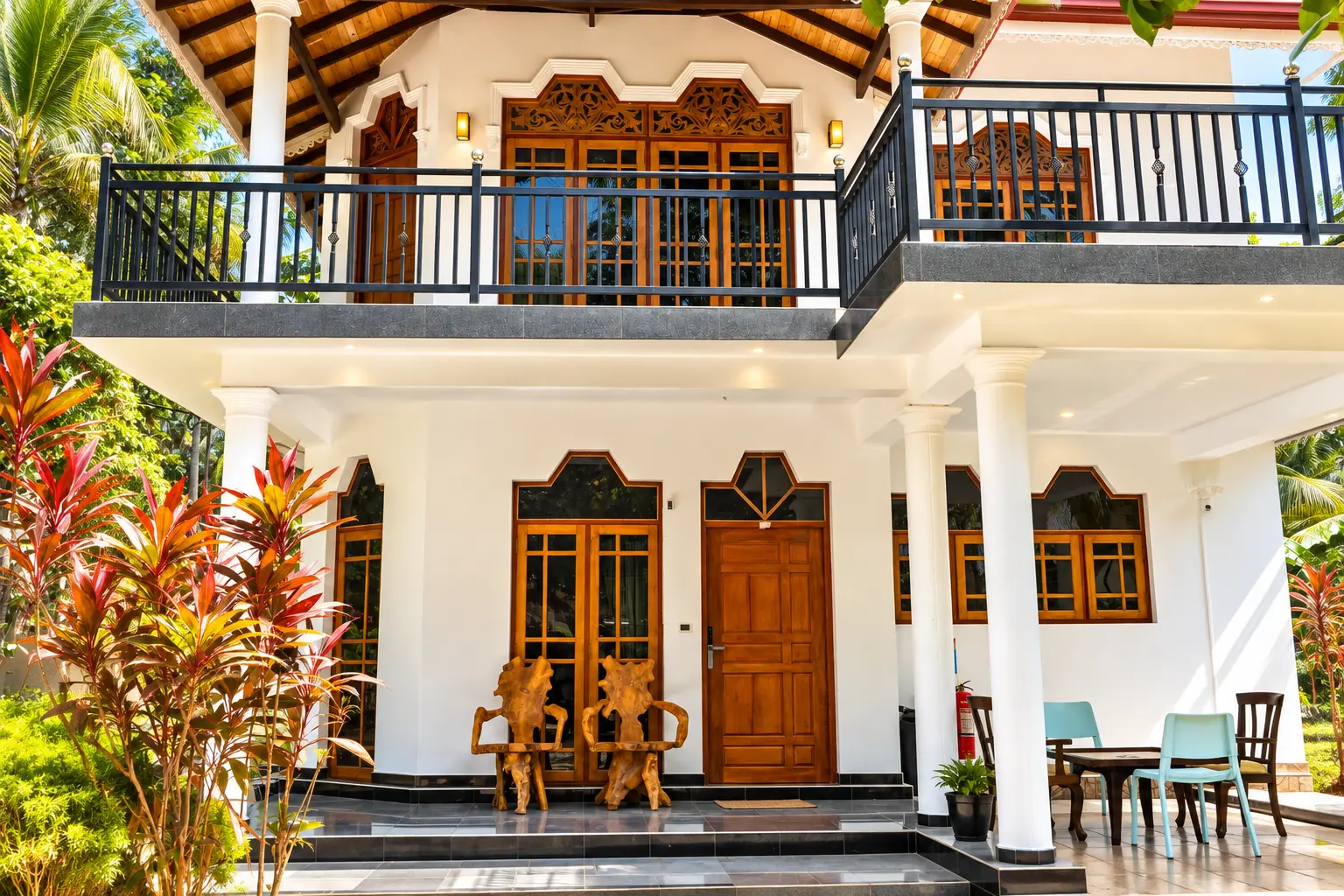 Veranda of Natarich villa in Marawila with carved teak doors